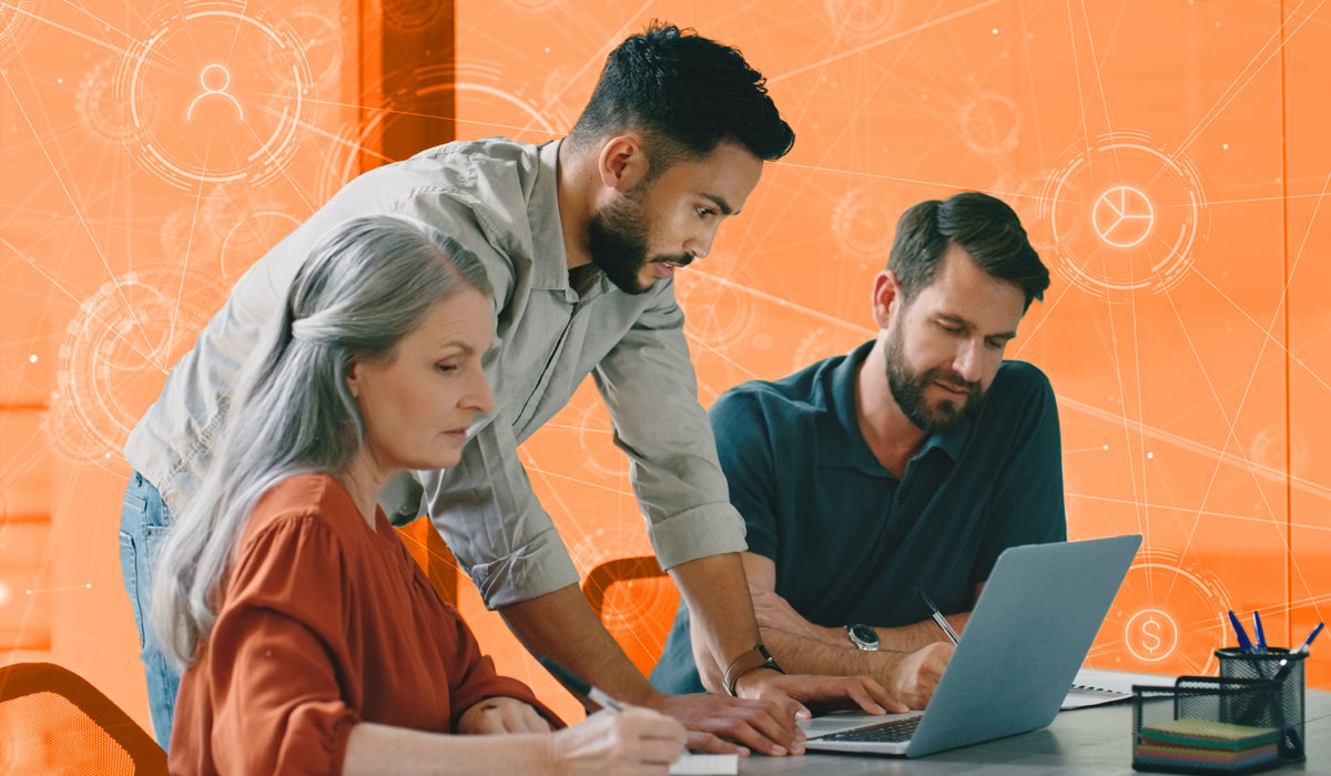 Three HR professionals looking at a laptop surrounded by data points, representing data-driven HR.